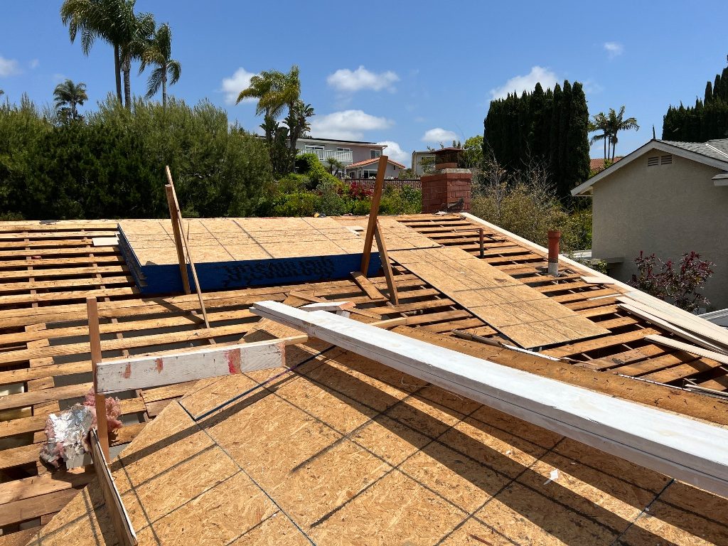 Roofing project in progress — underlayment and shingle installation