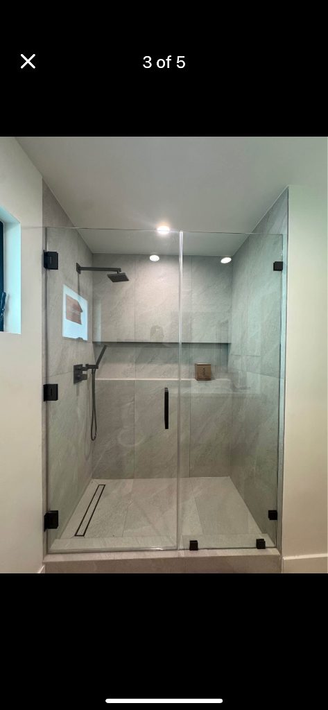 Remodeled bathroom with custom tile