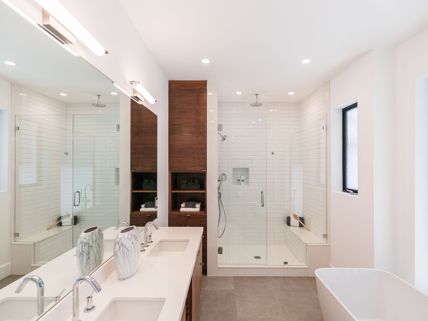 Modern bathroom remodeling with dual vanity and walk-in shower