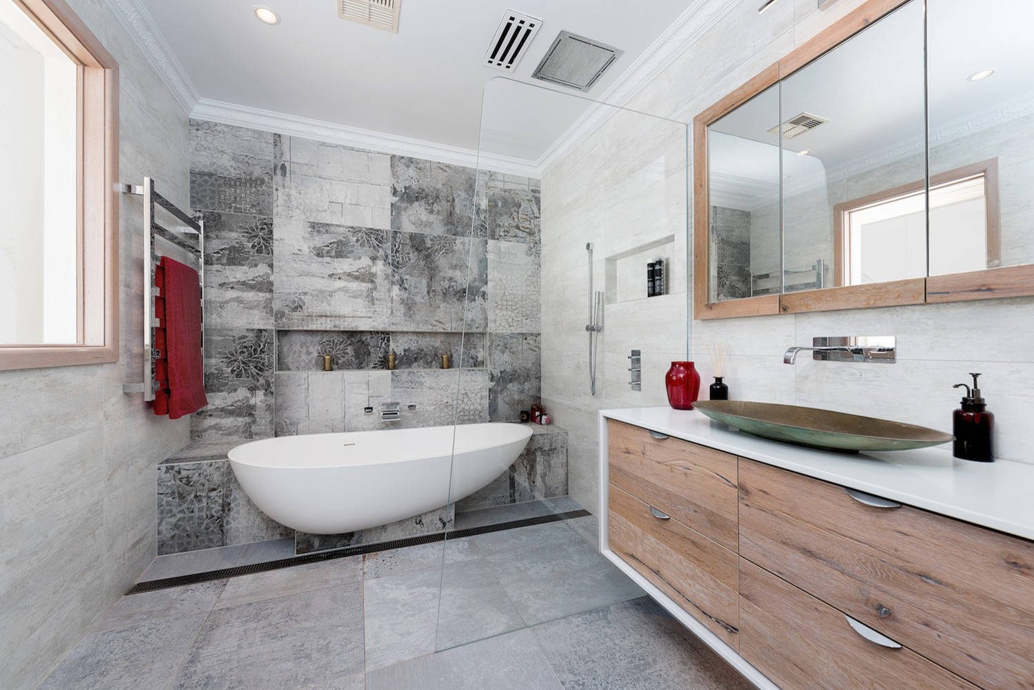 Bathroom remodeling project showcasing a freestanding tub and floating vanity