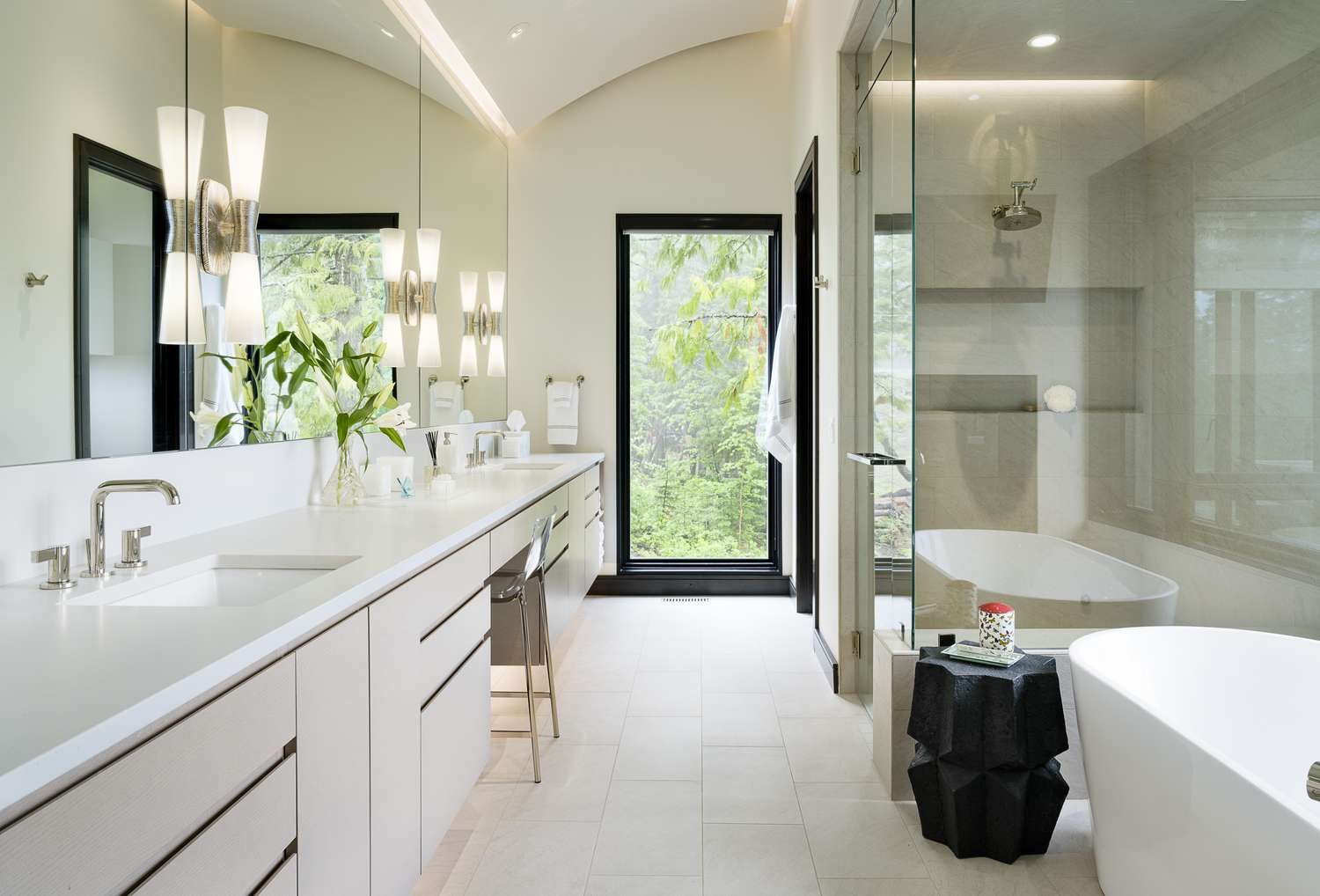 Modern bathroom renovation with a spacious walk-in shower and dual vanity