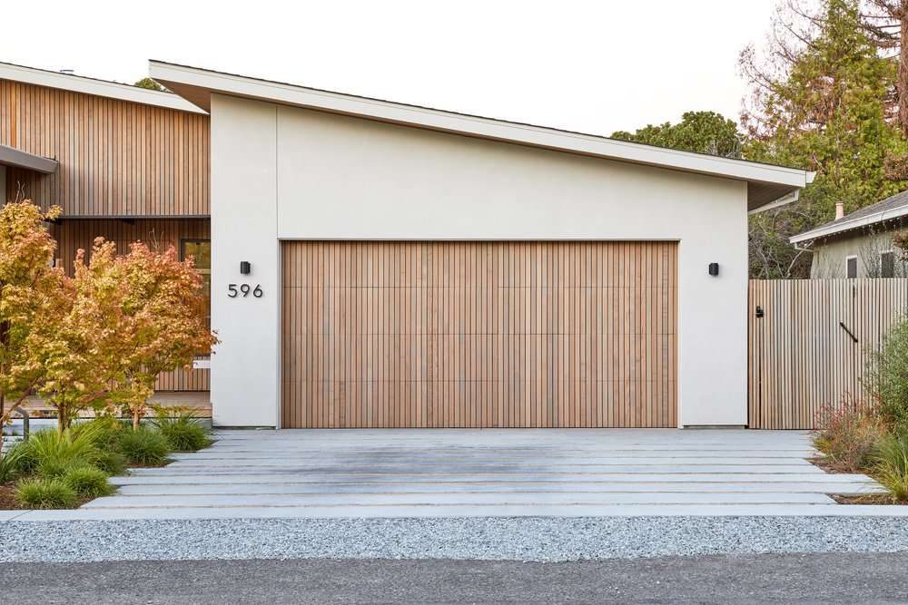 Finished modern concrete driveway in front of a contemporary home
