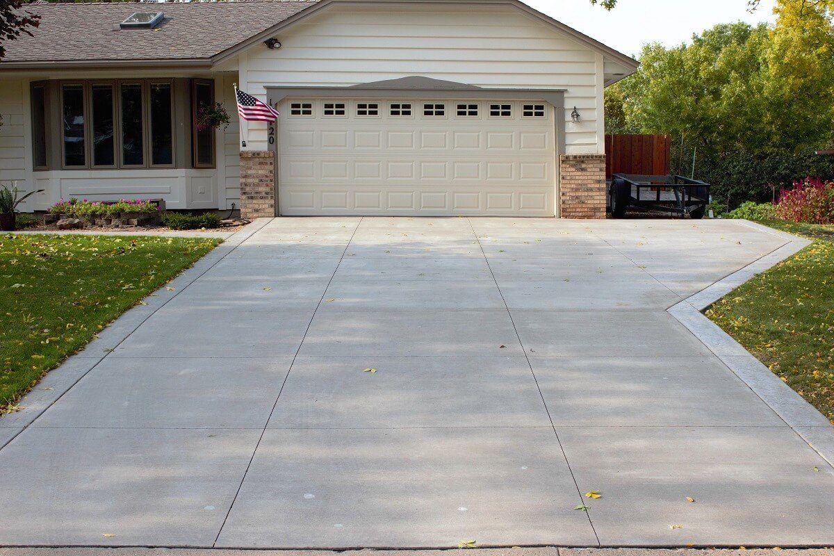 Newly poured concrete driveway with a broom finish