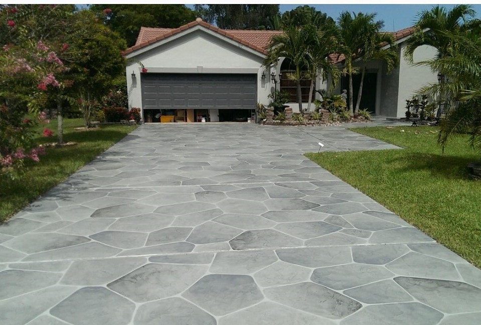 Decorative stamped concrete driveway with a cobblestone design