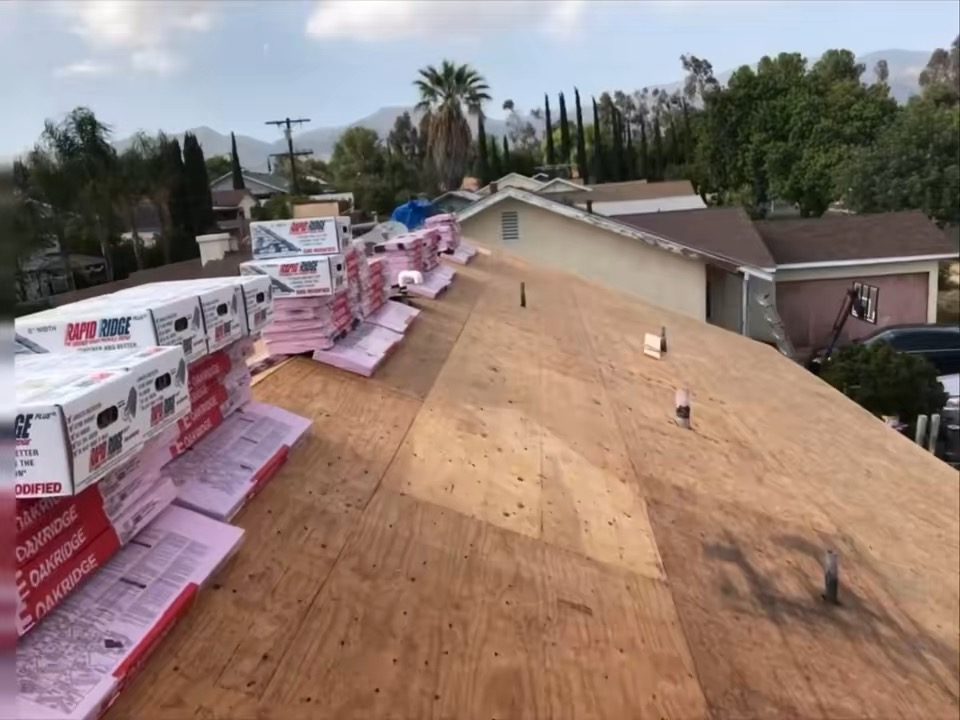 Roofing crew installing new shingles