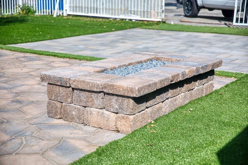 Stone fire pit on flagstone patio