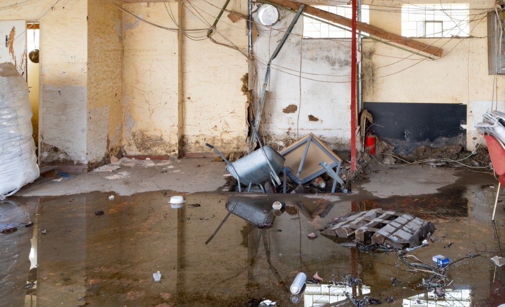 Flooded room with standing water requiring professional water damage restoration