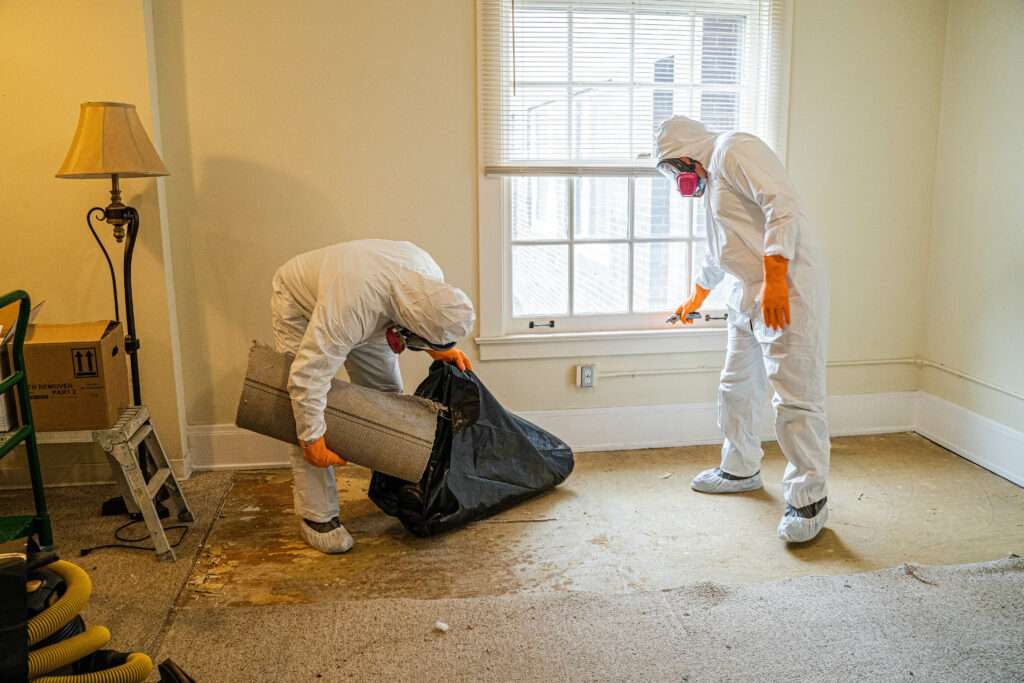 Technician cleaning up and restoring a water-damaged home
