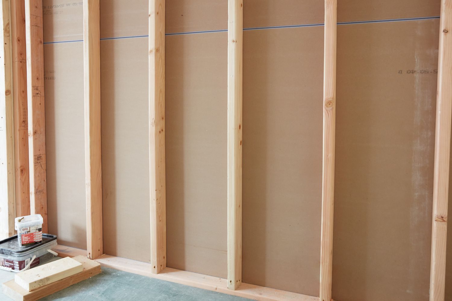 Wood and metal stud framing for interior walls during general remodeling