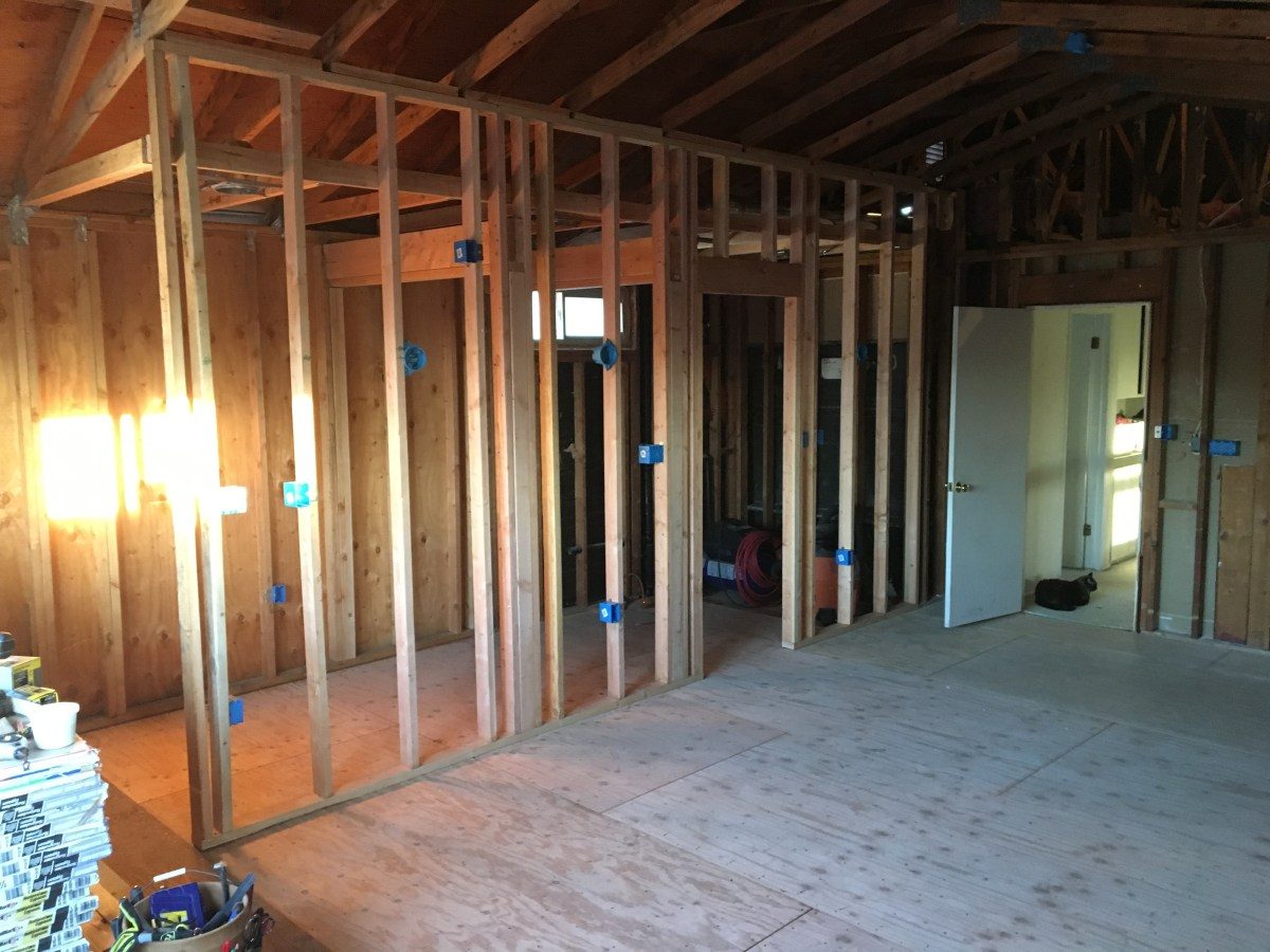 Finished modern living room with open concept design after general remodeling
