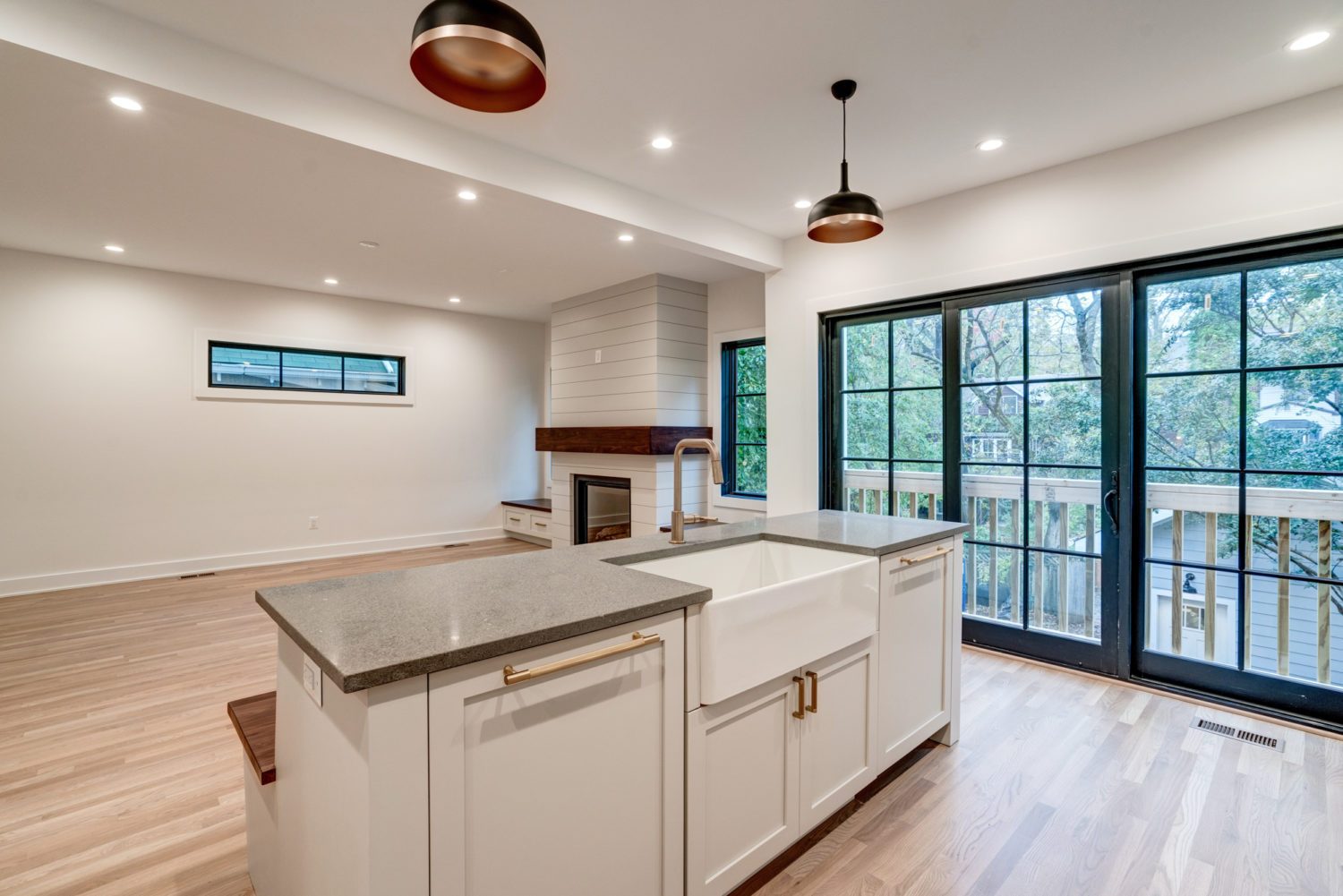 Custom kitchen island and cabinetry in a fully renovated modern home