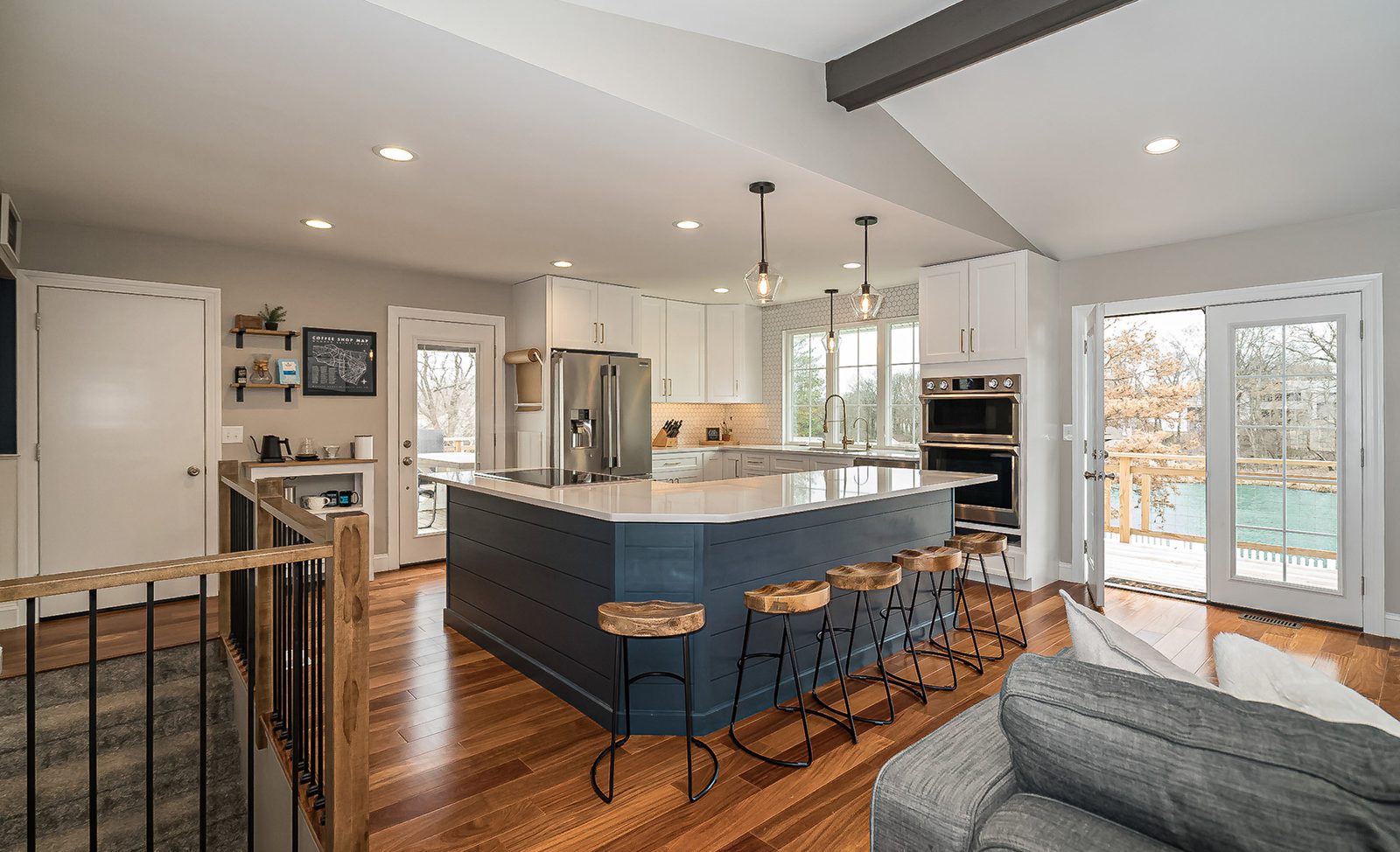 Open dining and kitchen area featuring high-end finishes in a renovated home